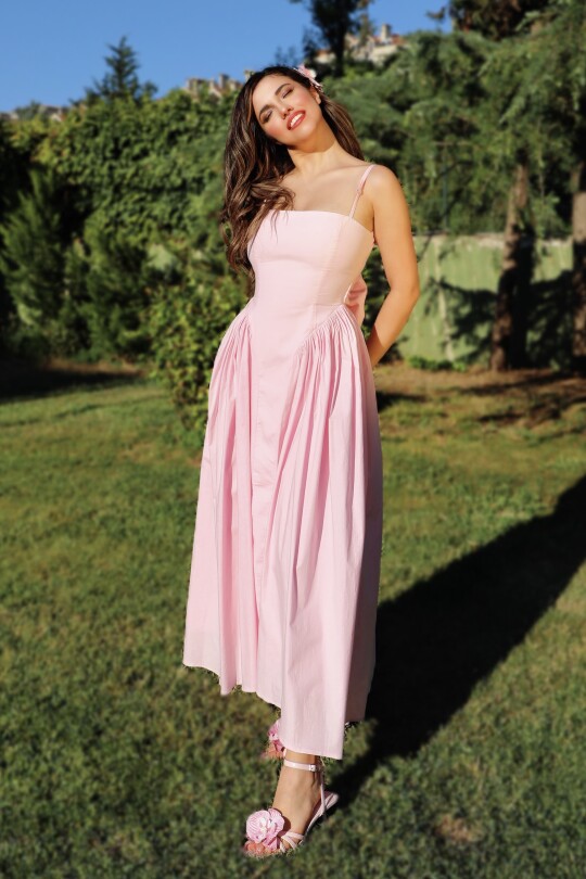 Pink midi dress with open back and bow detail 